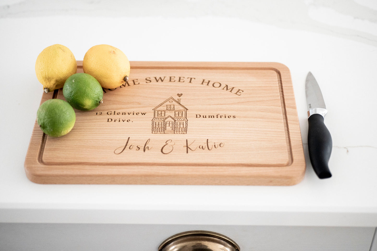 Personalized wooden cutting board from Custom Chic with "Home Sweet Home" engraving, ideal for housewarming or Christmas gift.