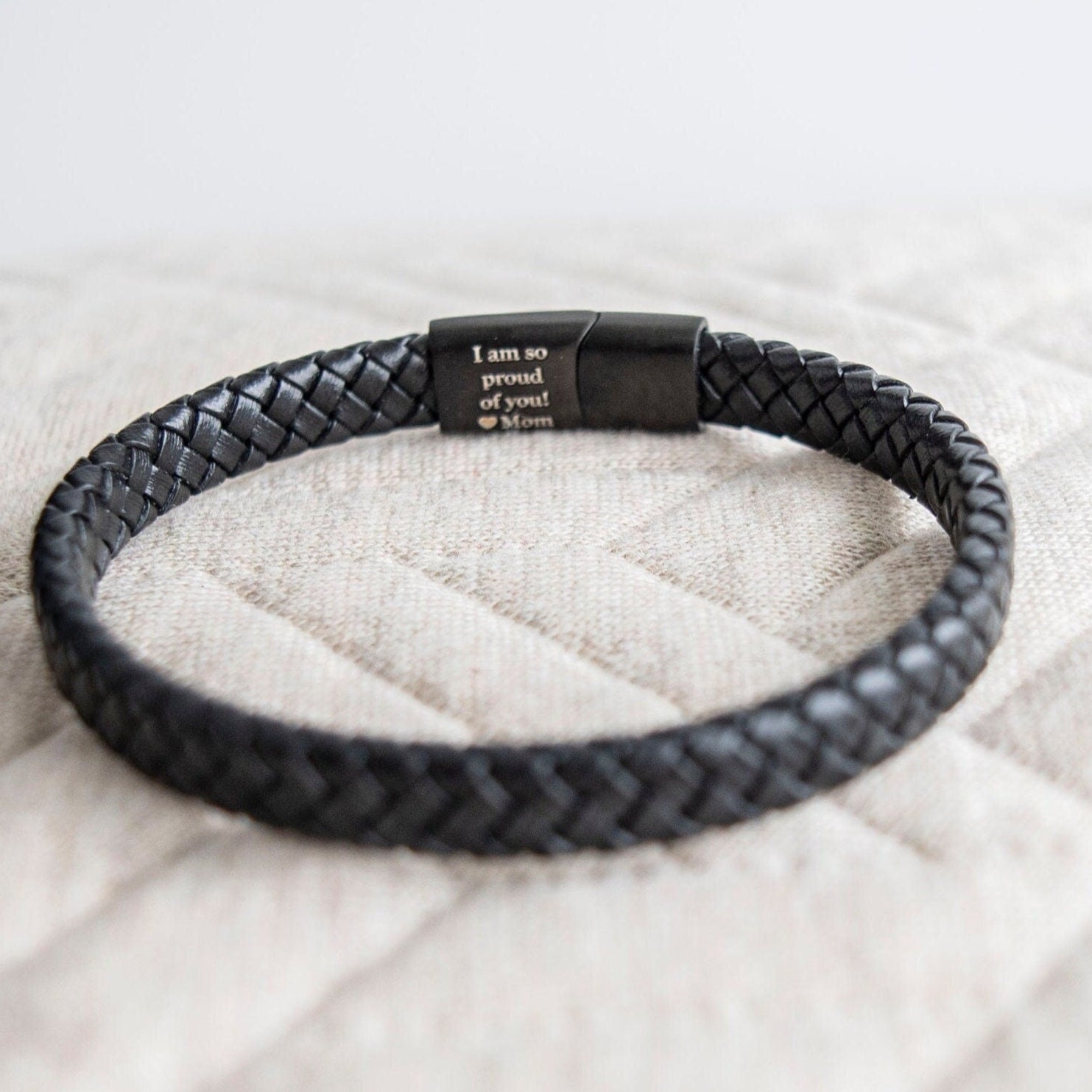 Men's matte black leather bracelet with hidden message from Custom Chic, featuring a sleek, minimalist design and adjustable strap.