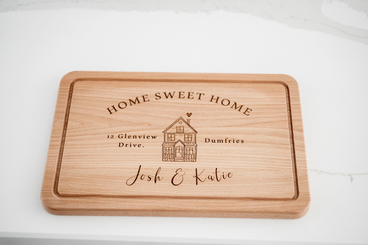 Personalized wooden cutting board with "Home Sweet Home" engraving, ideal housewarming or new home gift by Custom Chic