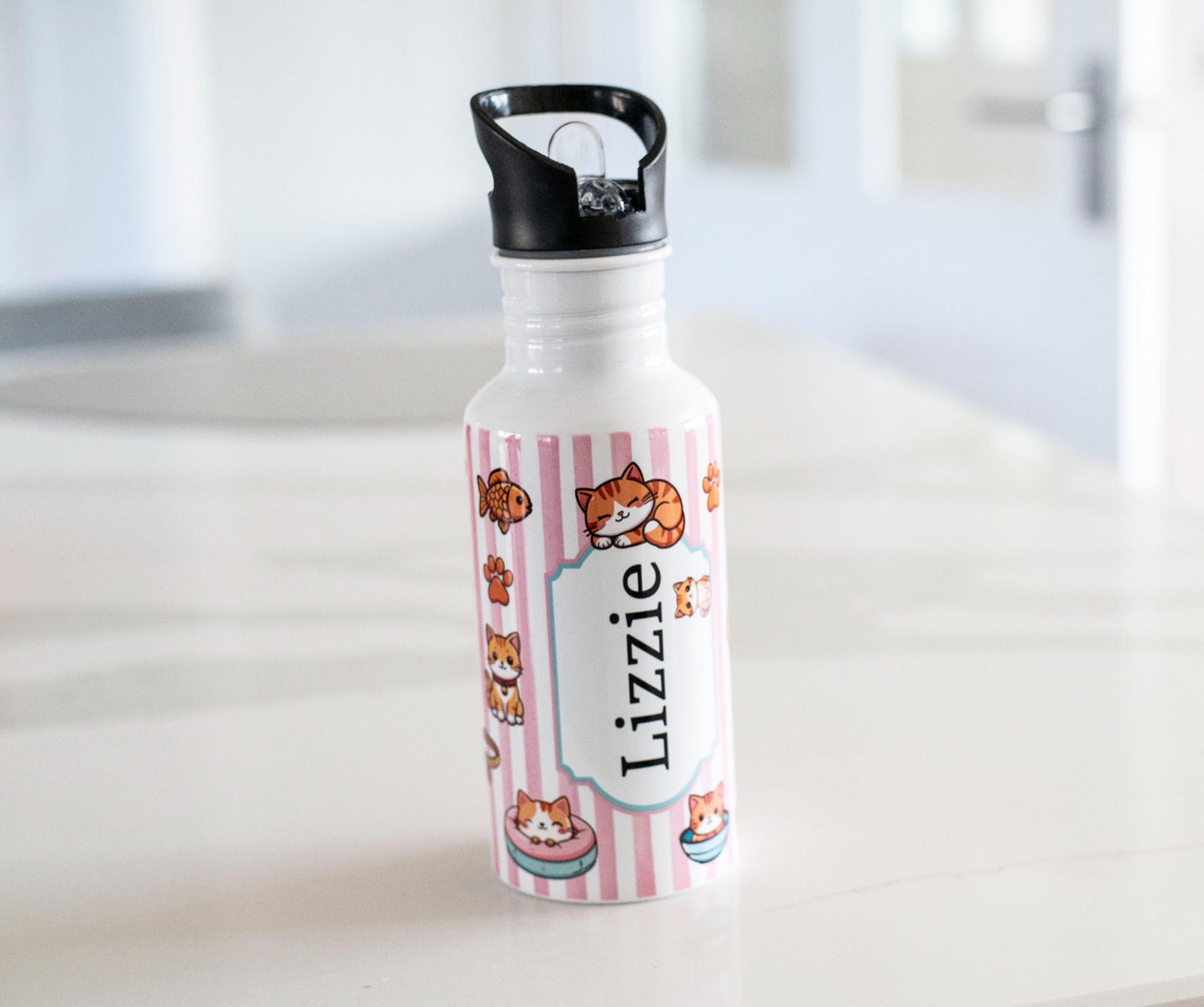 Personalized water bottle with cartoon character design on a white surface
