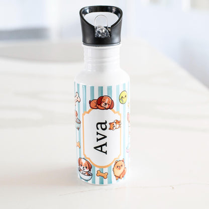 Personalized water bottle with cartoon designs and name 'Ava' on a white surface.