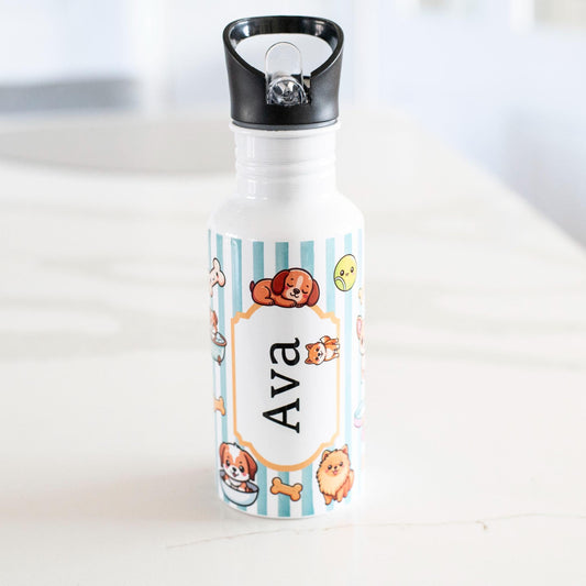 Personalized water bottle with cartoon designs and name 'Ava' on a white surface.